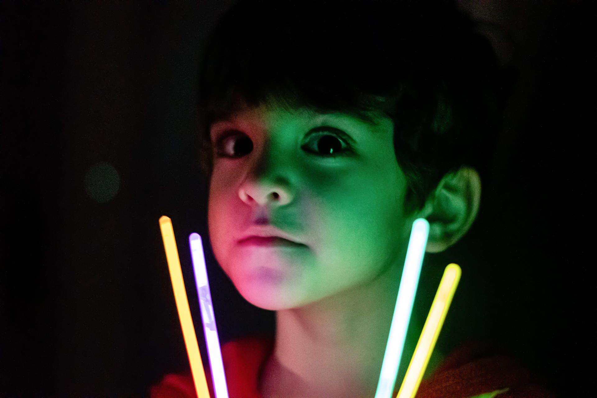 boy with glow sticks
